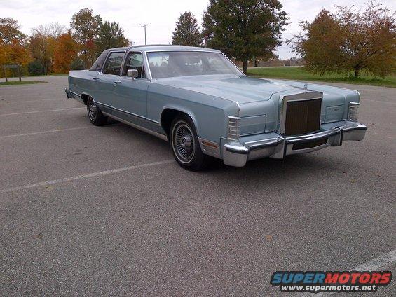 Light blue 1977 Lincoln Continental Mark V parked in a lot