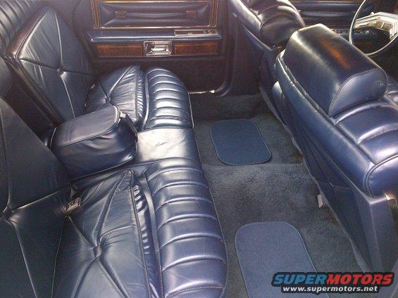 Blue leather seats and carpet inside a car