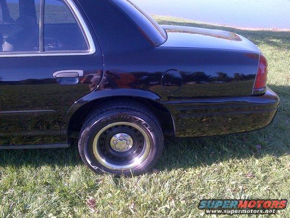 Black 2001 Ford Crown Victoria rear quarter panel and bumper
