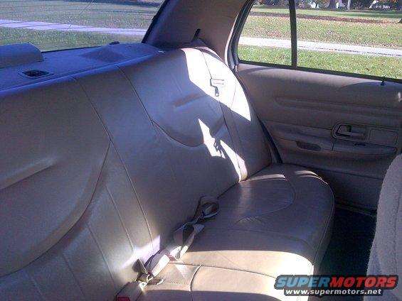 tan leather car seats and door panel