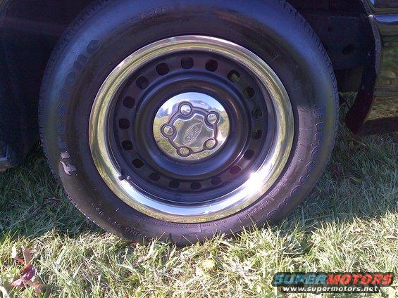 Wheel with Ford logo on black car