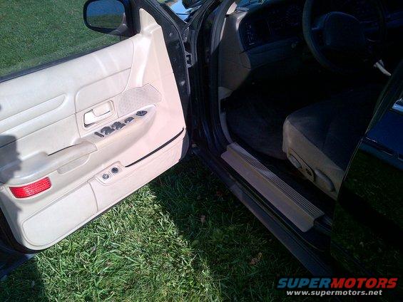 2001 Ford Crown Victoria interior showing driver's door panel and seat