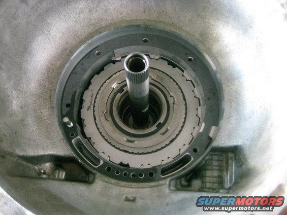 img_0697.jpg Intermediate clutches installed. The bottom steel is thicker and has a ridge on it. The ridge faces down when installed.

The new pump gasket is also installed. Note the bolt with the head cut off. this is used to align the pump as it is installed.