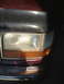 1996 Ford Bronco - Front corner view of a 1996 Ford Bronco, showing the headlight and turn signal assembly.