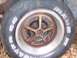 1970 Chevrolet Chevelle - A close-up shows a rusty wheel with raised white lettering on the tire.