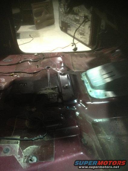 Interior floor of a vehicle with wiring exposed and door panels removed