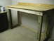 2004 Aston Martin Virage - A homemade wooden workbench is shown in a garage or workshop setting.