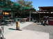1988 Ford Bronco - A large cowboy boot sculpture stands on a patio, with tables and chairs visible in the background.