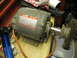 2004 Aston Martin Virage - Dayton split phase AC motor with wire brush attachment, likely for a bench grinder or similar tool.