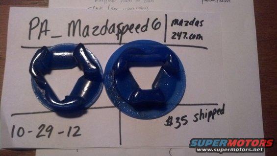 Two blue polyurethane bushings with a date 10-29-12 and price $35 shipped written on paper