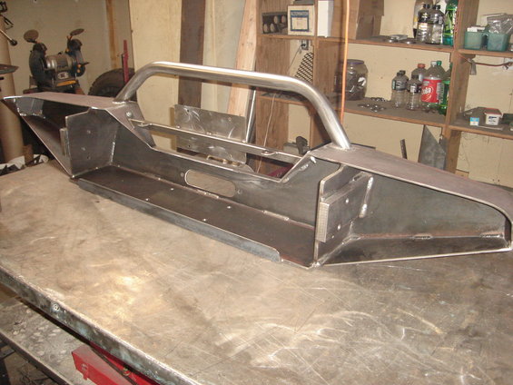 Custom fabricated steel bumper with integrated brush guard, unfinished metal