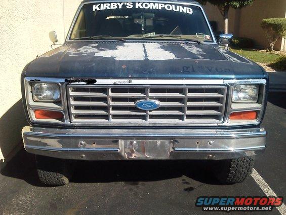 Front view of a 1985 Ford Bronco with a chrome grille and bumper