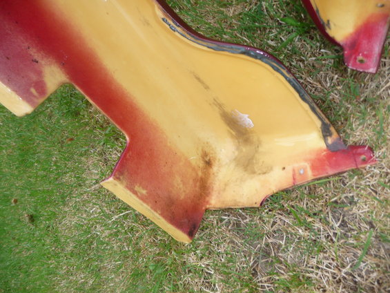 Yellow and red side skirts on grass