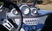 1967 Ford Mustang - The interior of a custom buggy features a dashboard with multiple gauges and switches.