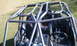 1967 Ford Mustang - Interior view of a custom buggy, a prominent roll cage and racing seats.