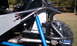 1967 Ford Mustang - Close-up of a custom buggy's rear suspension, a blue shock absorber and a black fluid reservoir.