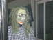 1989 Ford Bronco - A spooky zombie decoration with a creepy mask and disheveled hair is set up for Halloween.