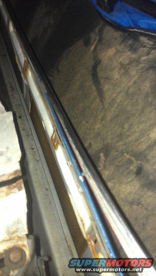 Chrome trim with rust and blue reflection