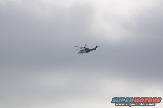 Helicopter flying in a cloudy sky