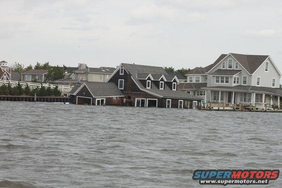 Waterfront houses submerged in floodwaters