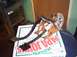 1991 Ford Crown Victoria - A car's pedal assembly, likely for brake and gas, rests on a Papa John's pizza box.