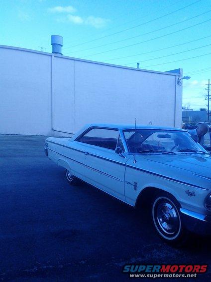 White 1963 Ford Galaxie 500 parked outside a building