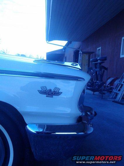 1960 Ford Thunderbird rear quarter panel with emblem and chrome bumper