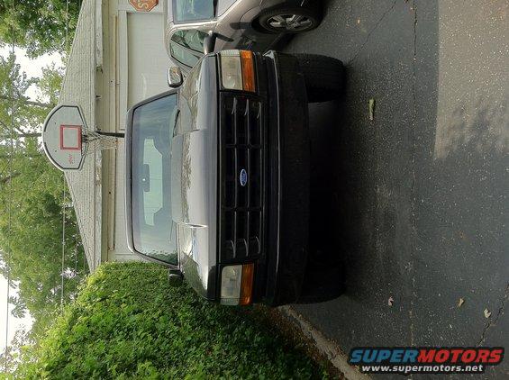 Black 1992 Ford Bronco front view parked next to another car