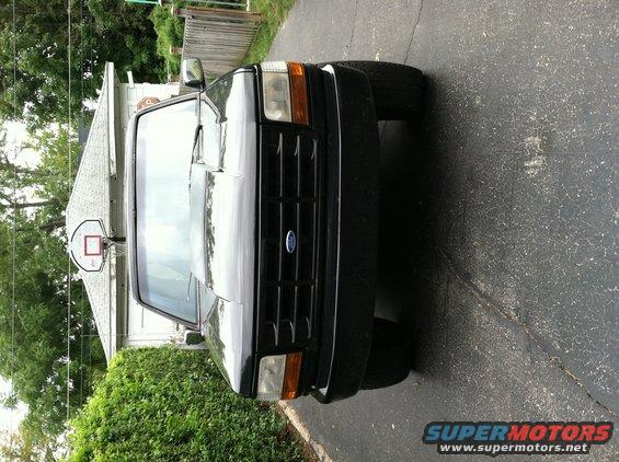 Front view of a black 1992 Ford Bronco parked on a driveway