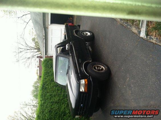 Black 1992 Ford Bronco parked in driveway, front 3/4 view