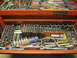 2004 Aston Martin Virage - A variety of tools are neatly organized within an open red tool chest.