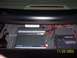2003 Ford Taurus - The trunk of a car houses a car audio system with two amplifiers and associated wiring, dated 11/22/2003.
