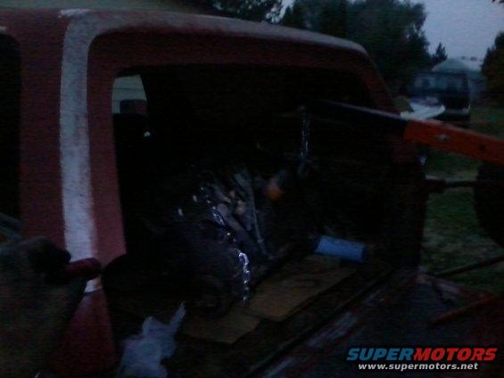 120921_003.jpg It's visible how long it took me to get the engine from the truck to the back of my Bronco.  The previous picture of removing the engine is in daylight, and this is almost dark.

Moving an engine hoist with and engine hanging from it on soft dirt and grass, by yourself, takes a long time....