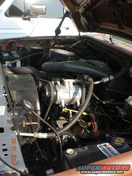 Engine bay with AC compressor and hoses visible. Date stamp reads 09.01.2009