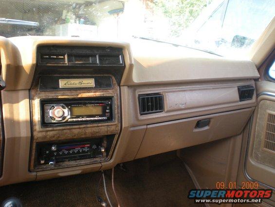 1986 Ford Bronco interior dashboard with Eddie Bauer trim, aftermarket stereo, and dual DIN units