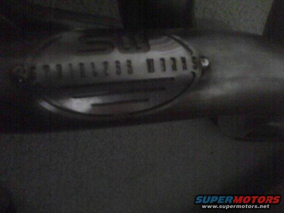 Exhaust pipe with 'STAINLESS WORKS' emblem