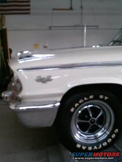 Front fender and wheel of a white 1963 Ford Galaxie 500 with chrome trim and a '500' badge