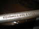 2004 Aston Martin Virage - Close-up of a metal rod showing stamped text 'CORNWELL 2 USA * 2130'.