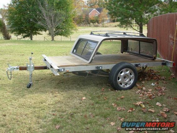 65struts.jpg I finally found some junkyard lift struts that would fit & work to hold the deck tilted, and installed them.