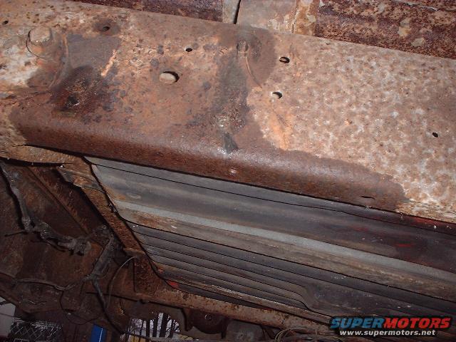 Rusted frame section with visible wiring