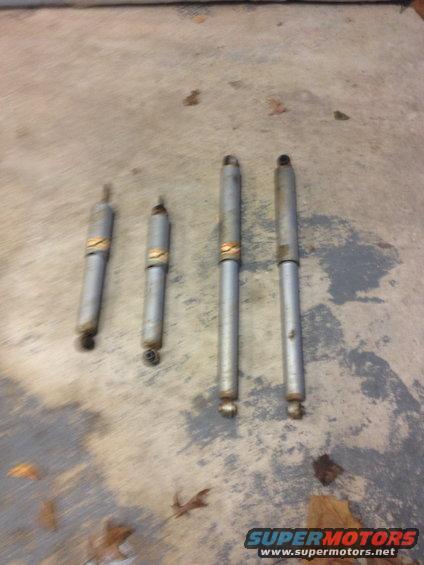 Four shock absorbers on concrete floor