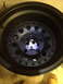 1996 Ford F-150 - Close-up view of a black aftermarket wheel, likely for a truck or SUV.