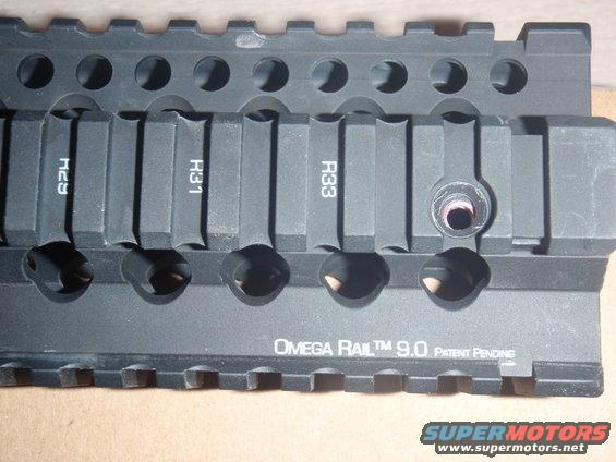 Close-up of an Omega Rail 9.0 accessory with markings H29, H31, and R33