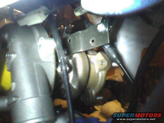 Close-up of a vehicle's brake caliper and related hardware
