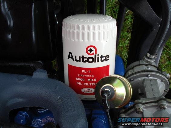 Autolite FL-1 oil filter with Ford logo, next to engine components