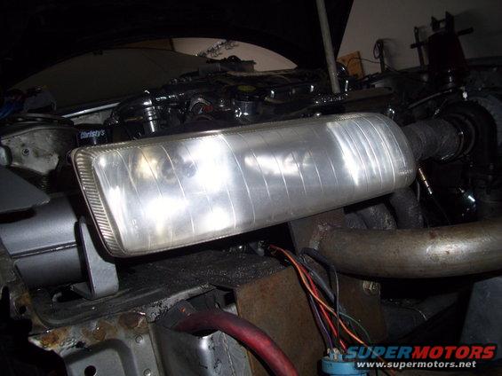 Headlight assembly with engine parts and wiring visible