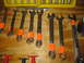 2004 Aston Martin Virage - A collection of Craftsman wrenches, some marked with orange tape, are laid out on a workbench.