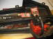 2004 Aston Martin Virage - A red chainsaw, labeled "Elite 15", is shown in its case alongside Homelite 18" bar and chain oil packages.