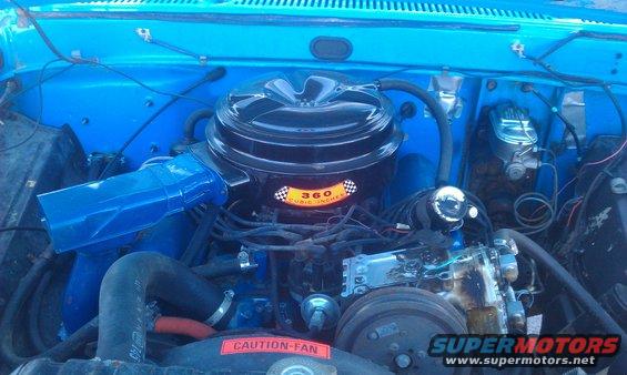 Blue engine bay with a black air cleaner showing '360 CUBIC INCHES'