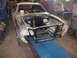 1978 Ford Mustang II - Front view of a 1978 Ford Mustang II undergoing restoration in a workshop.